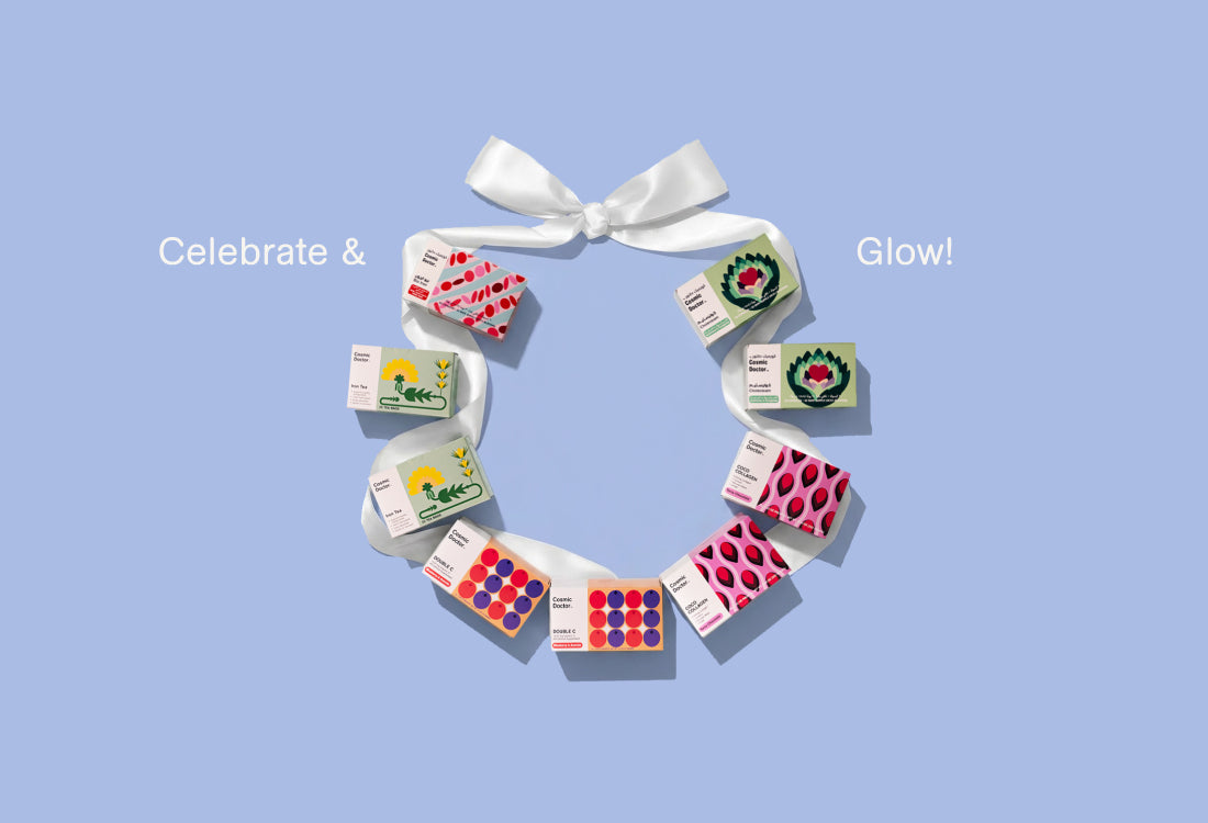 Decorative wreath made of small boxes of Cosmic Doctor with colorful designs on a light blue background.